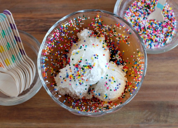 Adding Sprinkles to a Frozen Syrup Ice Cream Sundae