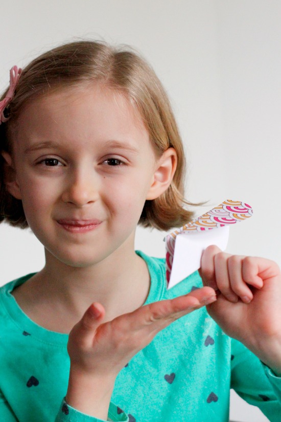 Kids Making Valentine Heart Airplanes @makeandtakes.com