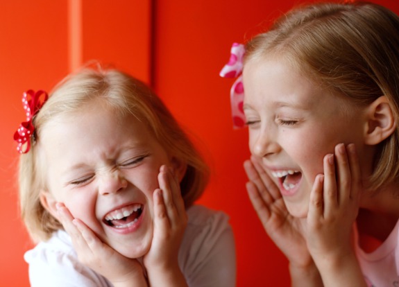 Laughing Girls wearing hair bows