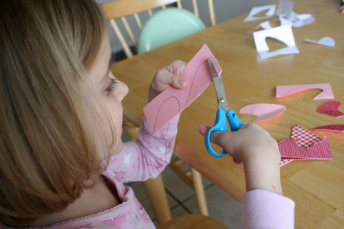 Practice cutting with toddler scissors