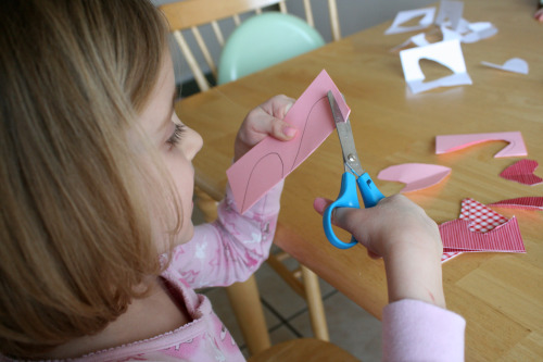 Practice cutting with toddler scissors
