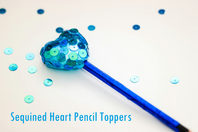 A simple, tutorial to make Sequined Styrofoam Heart Pencil Toppers. A great kid craft for Valentine's day and beyond! Guest post by ArtsyCraftsyMom for Makeandtakes.com