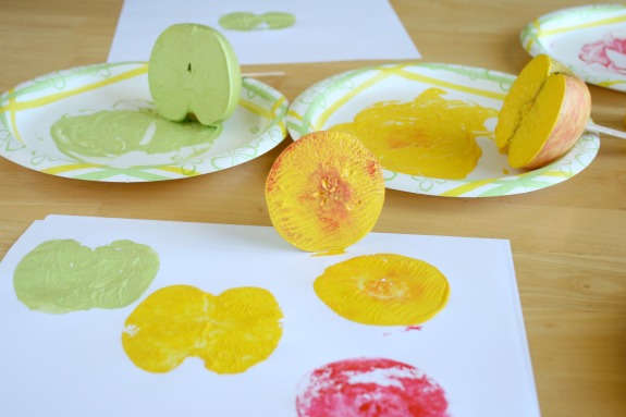 Stamping Apples in Paint for a fun Apple Print