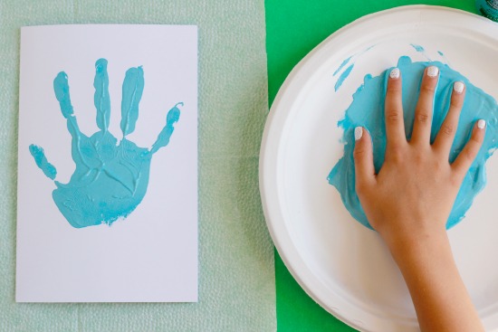 Stamping Kids Painted Hands