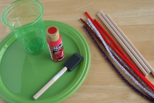 Supplies for Painting a craft bow and arrow