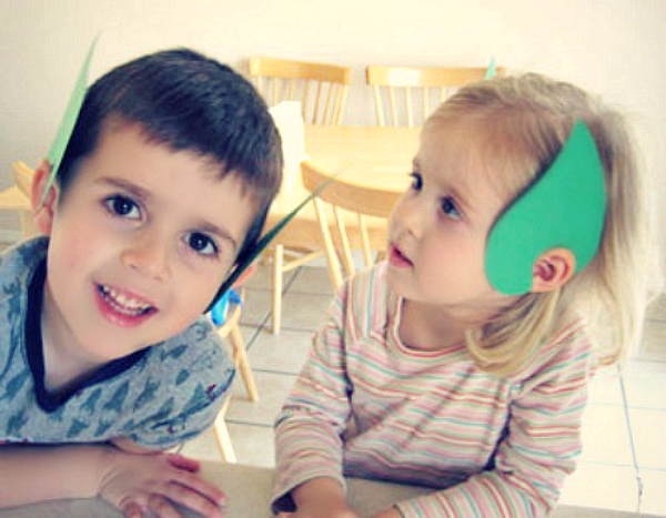 Wearing Leprechaun Paper Ears for St. Patrick's Day