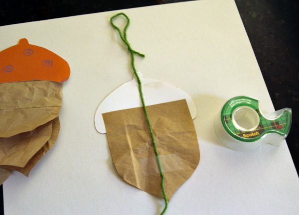 Paper and yarn acorn garland