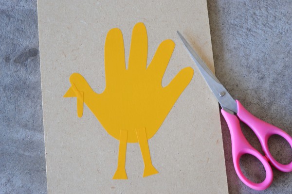 cutting and glueing handprint