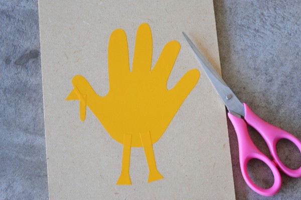 cutting and glueing handprint