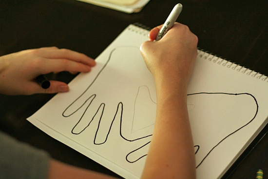 Tracing hands in art journal