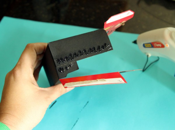 Assembling a cardboard play camera