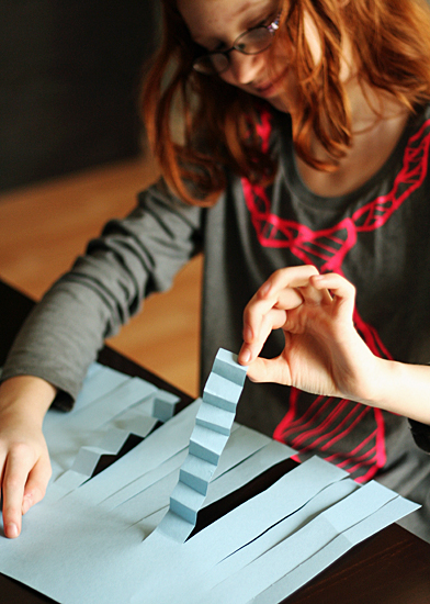 Accordion folding paper strips