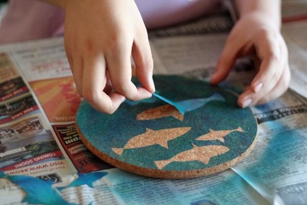 Fish stickers and airbrush painted coasters