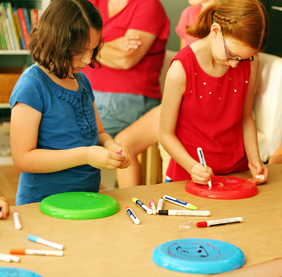 Coloring frisbees with paint pens