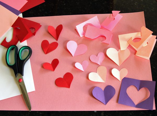 Cutting paper hearts for Valentine cards