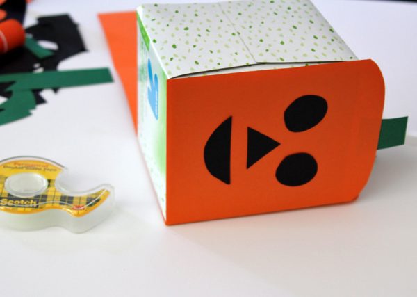 Making a jack-o'-lantern tissue box