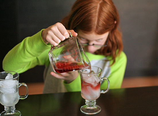 Pouring Fancy Layered Drinks for Kids for New Year's Eve #NYE @makeandtakes.com
