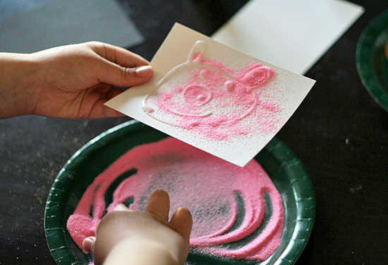Colored sand and glue drawings