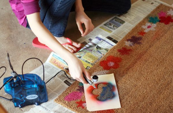 Spring flower doormat made with airbrush and stencils