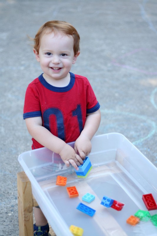 Playing with Lego Duplos in the water table