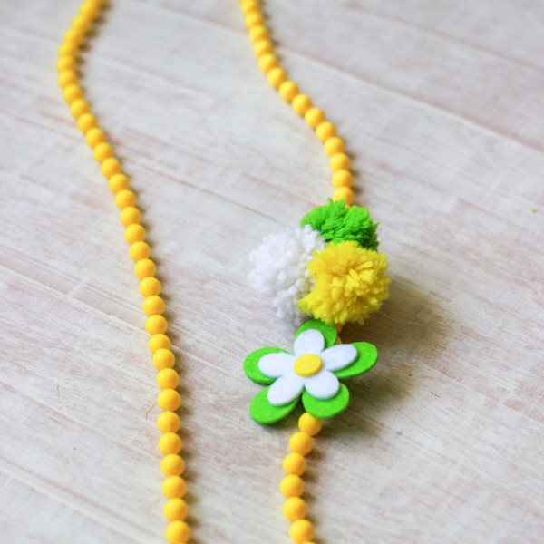 Make this DIY Pom Pom Yarn Necklace