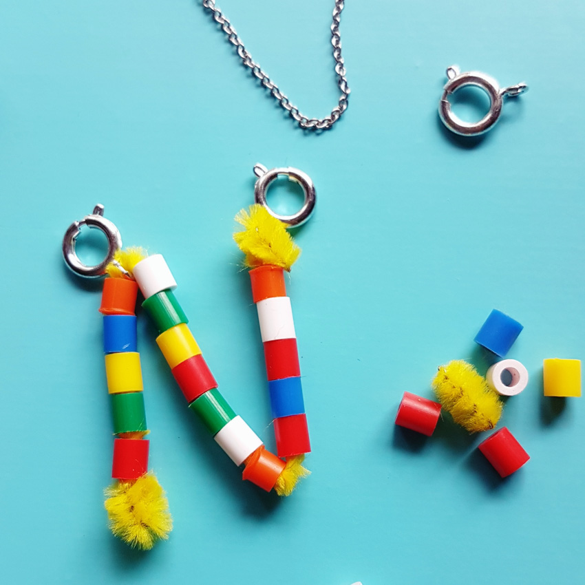 This DIY Pipe Cleaner Monogram Pendant Necklace makes the cutest favors for a birthday party. Fun and Colorful, it's sure to be a big hit with kids!