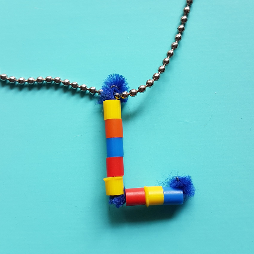 This DIY Pipe Cleaner Monogram Pendant Necklace makes the cutest favors for a birthday party. Fun and Colorful, it's sure to be a big hit with kids!