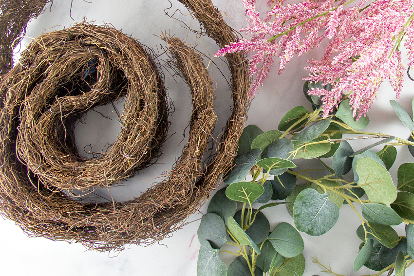 vine wreath, eucalyptus leaves and pink flowers to make a wreath