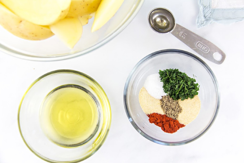 seasoning blend and olive oil for making baked potato wedges