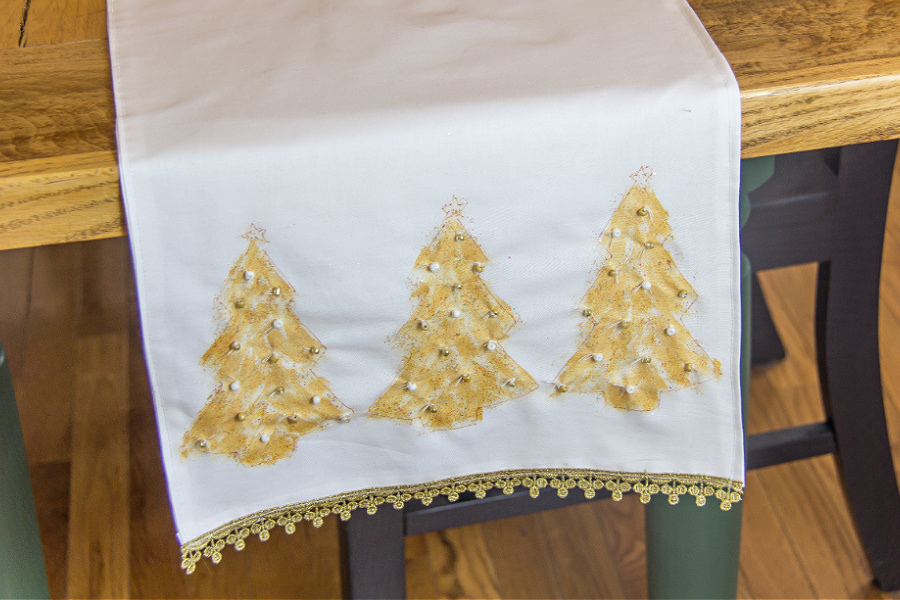 White table runner with hand-painted gold christmas trees and beads