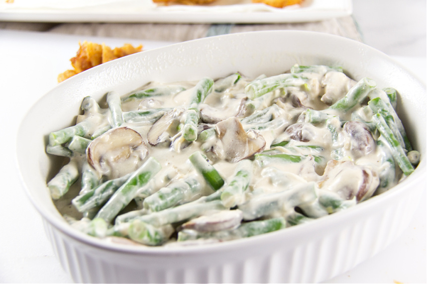 green bean casserole being made with cream cheese