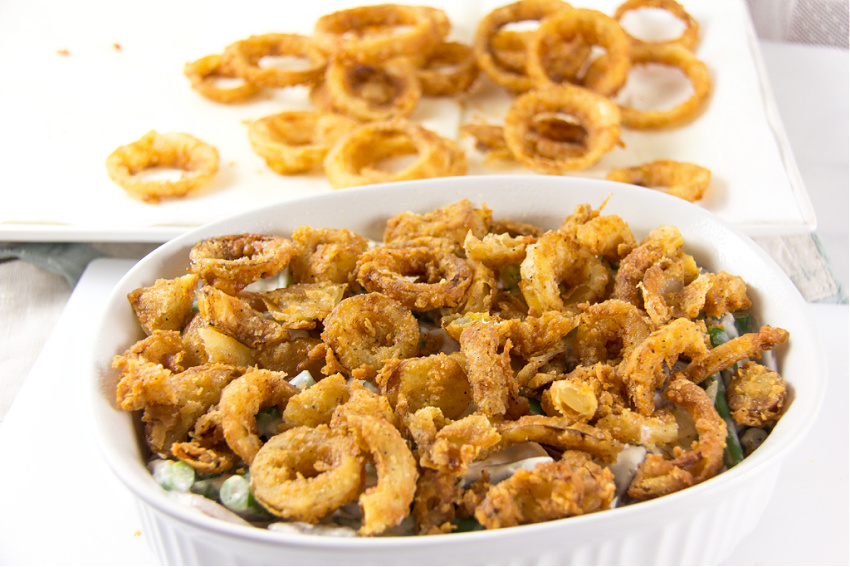 green bean casserole made with deep friend onion rings and fresh produce