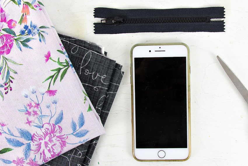 a phone and fabric to measure for a phone purse