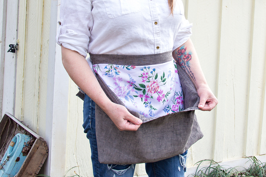 a large pocket sewn onto an apron for collecting vegetables and eggs