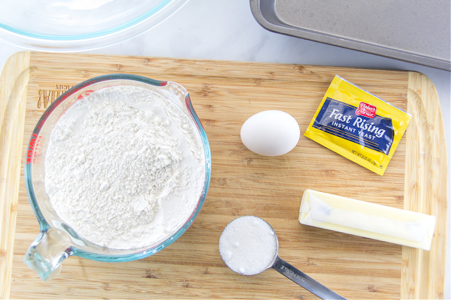 Ingredients including bread flour and instant yeast to make dinner rolls