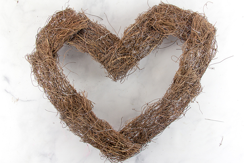 a natural vine heart shaped wreath